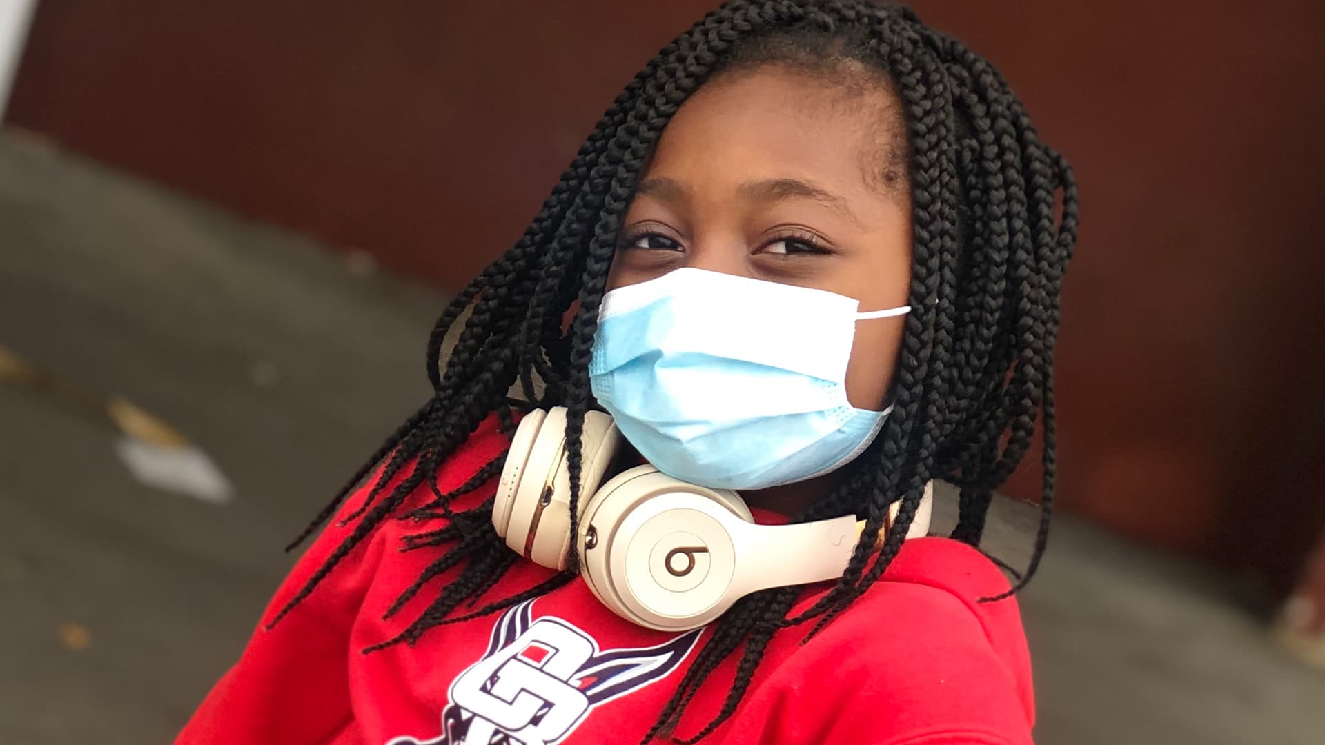 Dallas Sickle Cell Patient Smiling Behind a Mask